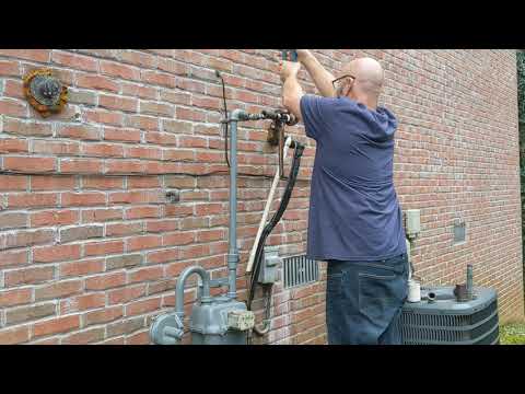 Tapping on to a gas meter.